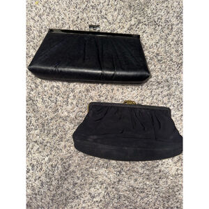 two preowned black clutches 